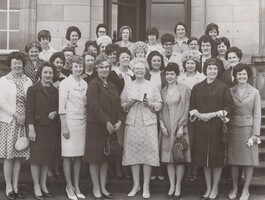 Group of ladies standing together outside on steps